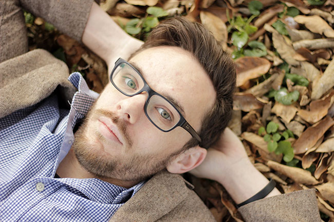 Glasses guy laying in leaves