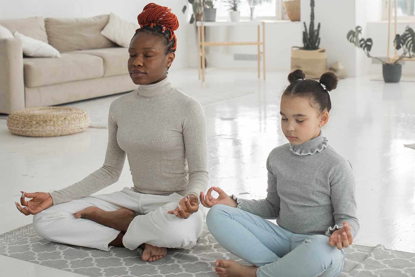 A woman and a child meditating