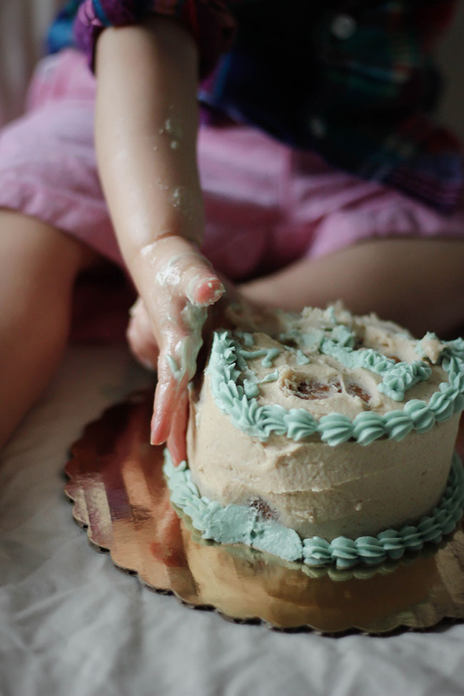 Baby playing with cake